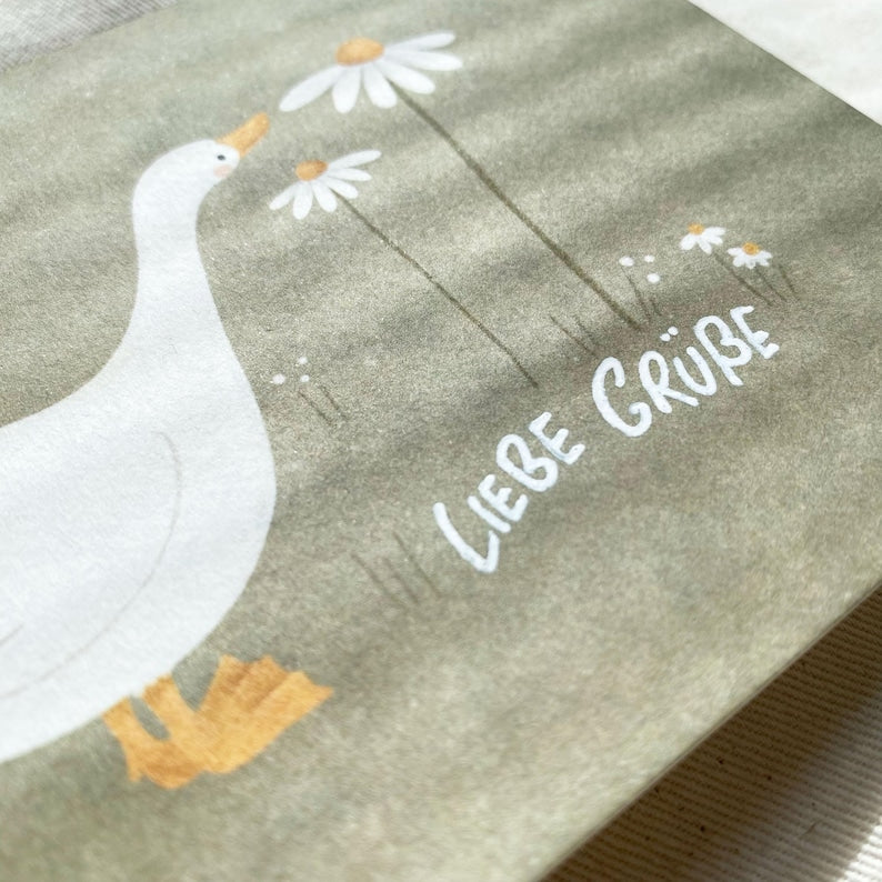 Grußkarte Gans mit Blümchen, A6 Postkarte, 500g Holzschliffpappe, bunt, doppelseitig beschreibbar